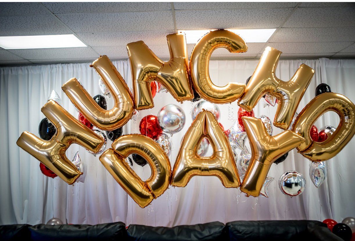 A Huncho Day display with balloon letters and individual balloons