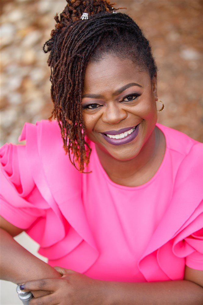 Close-up portrait of Party Divas founder smiling outdoors