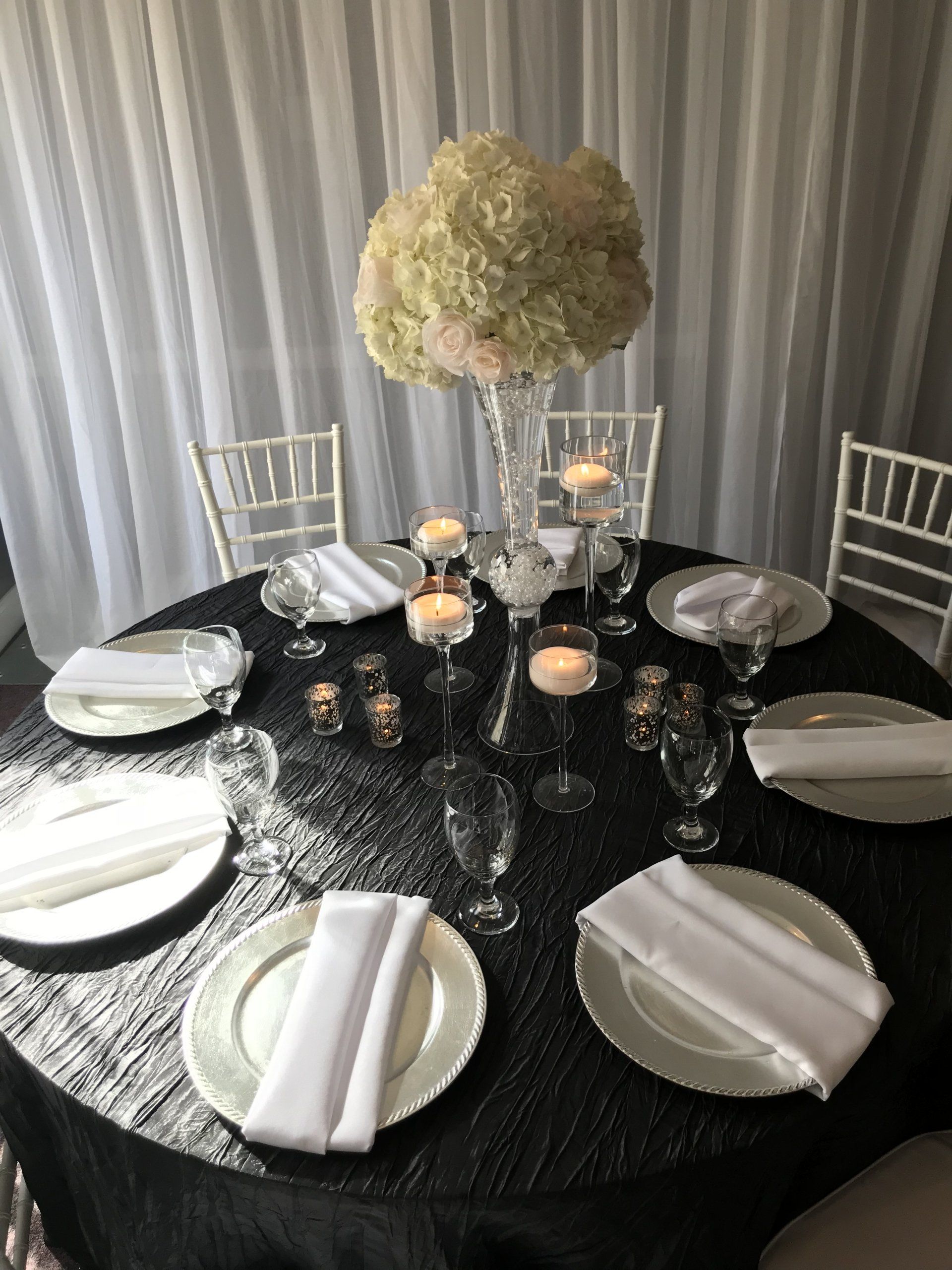 Table set up design with tall floral arrangement