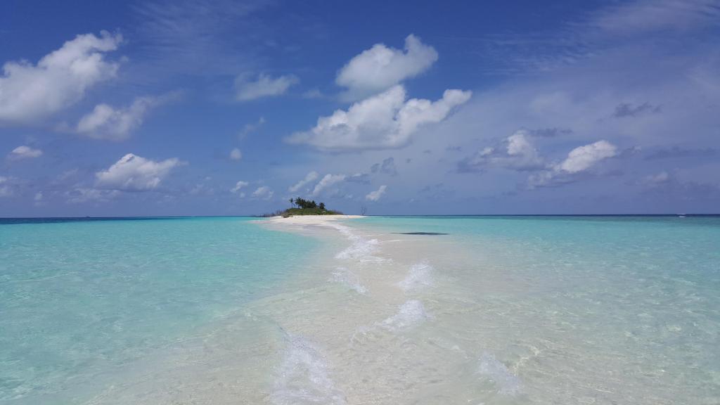 A small island in the middle of the ocean.