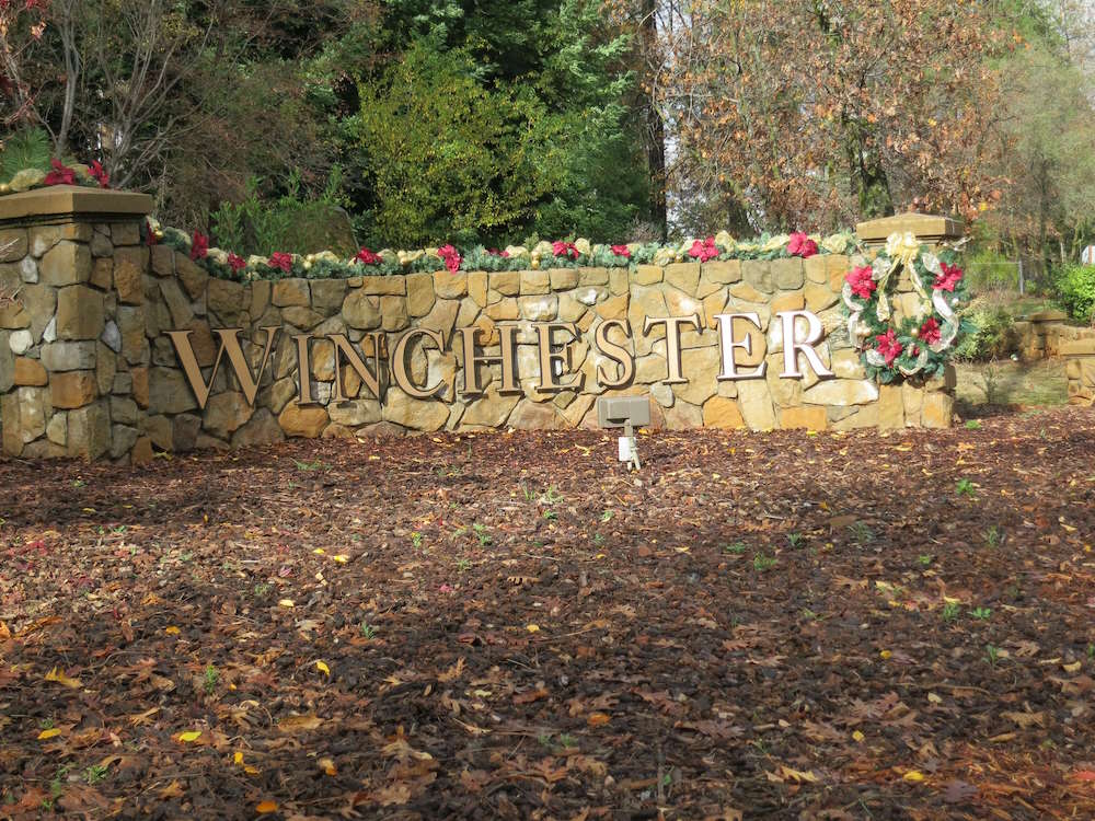 A stone wall with the word winchester on it