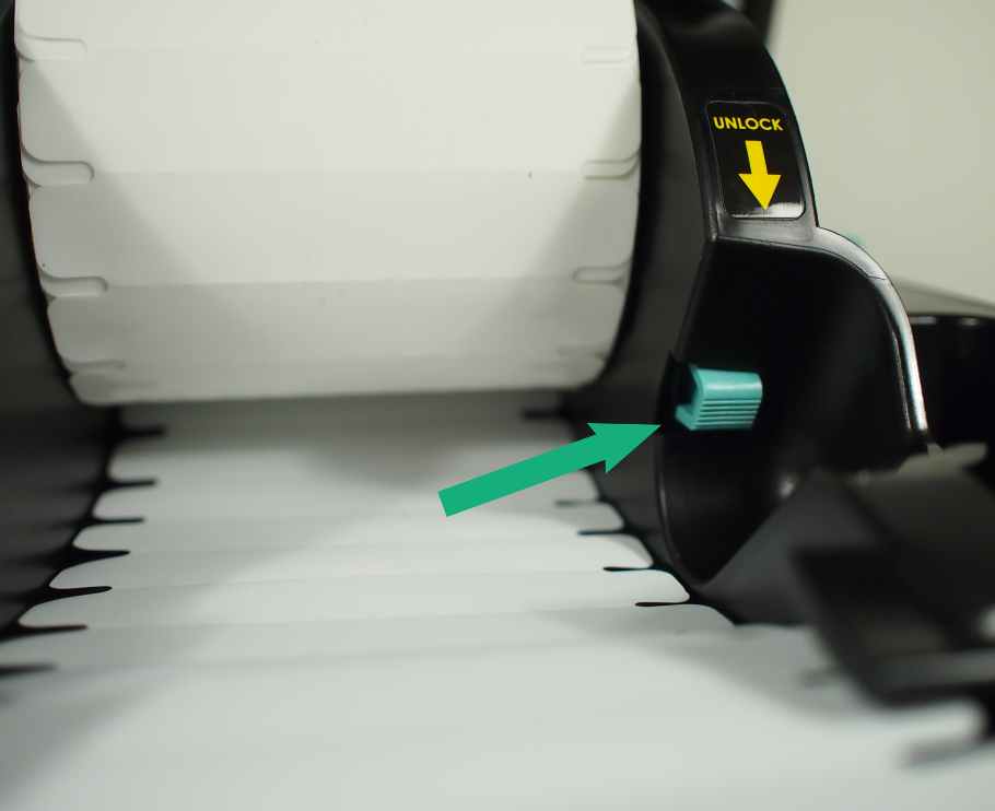 Press the unlock button to easily install the Clothing Labels within the guides