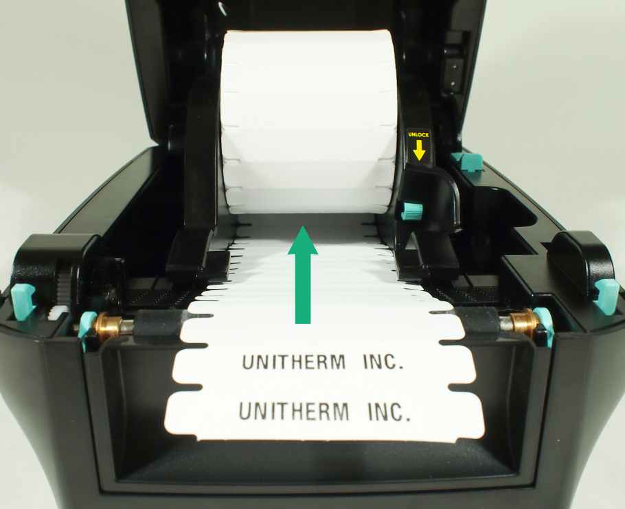 The rolls of Clothing Labels should unwind from the bottom