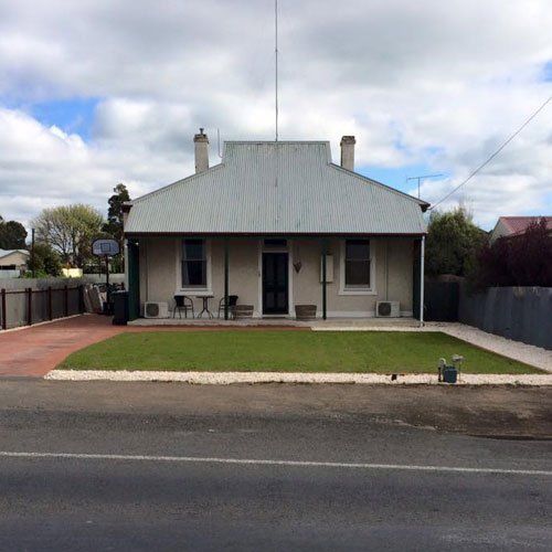 house with newly landscaped yard house with newly landscaped yard