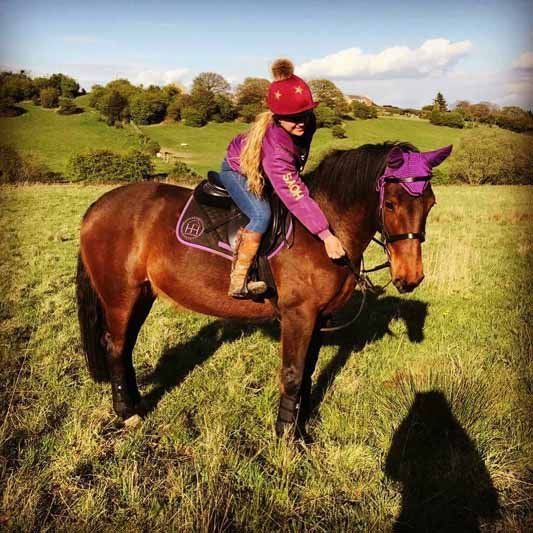 a Child sit on horse