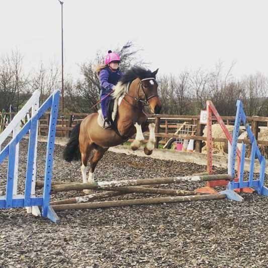 A Child doing horse riding