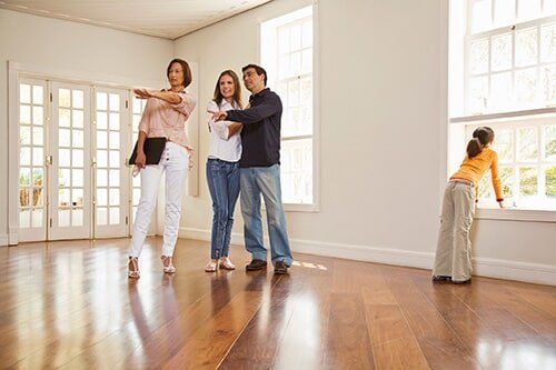 Home Prices — Real Estate Agent Discussing with Client in Montgomery, AL