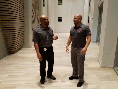 Security man check businessman at entrance in office building or airport