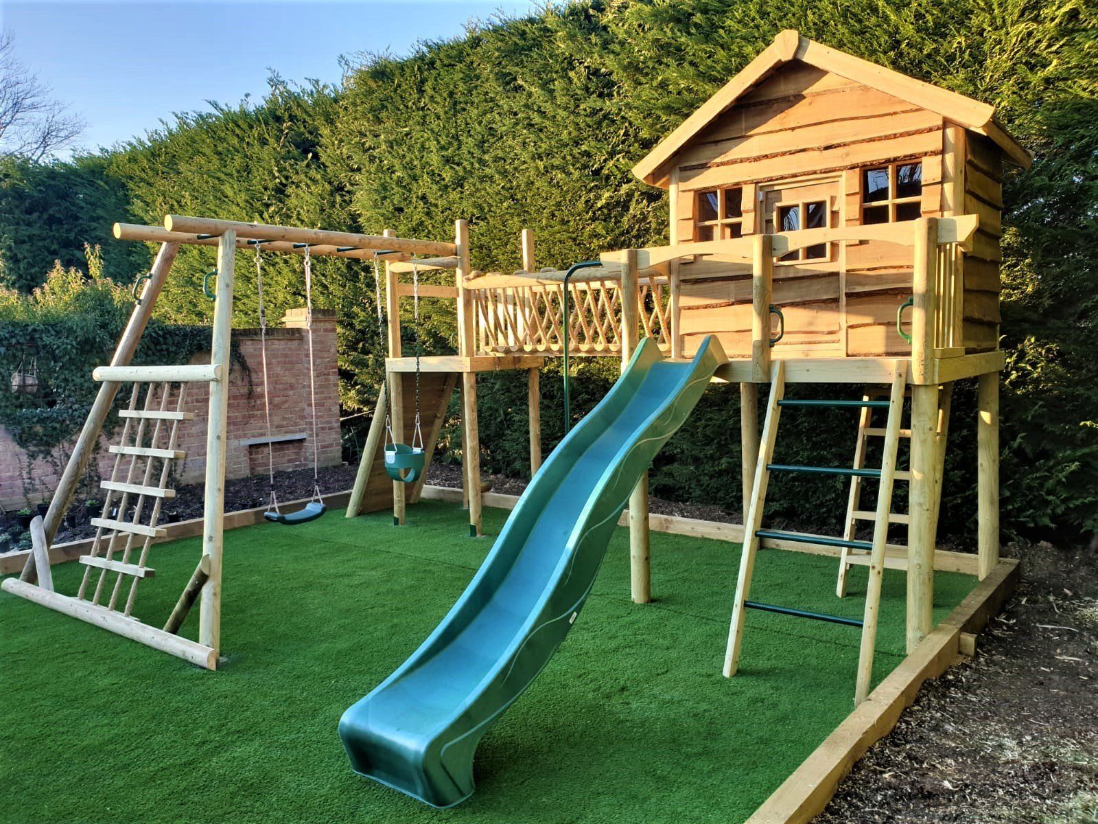 Rainbow coloured climbing frames and play house