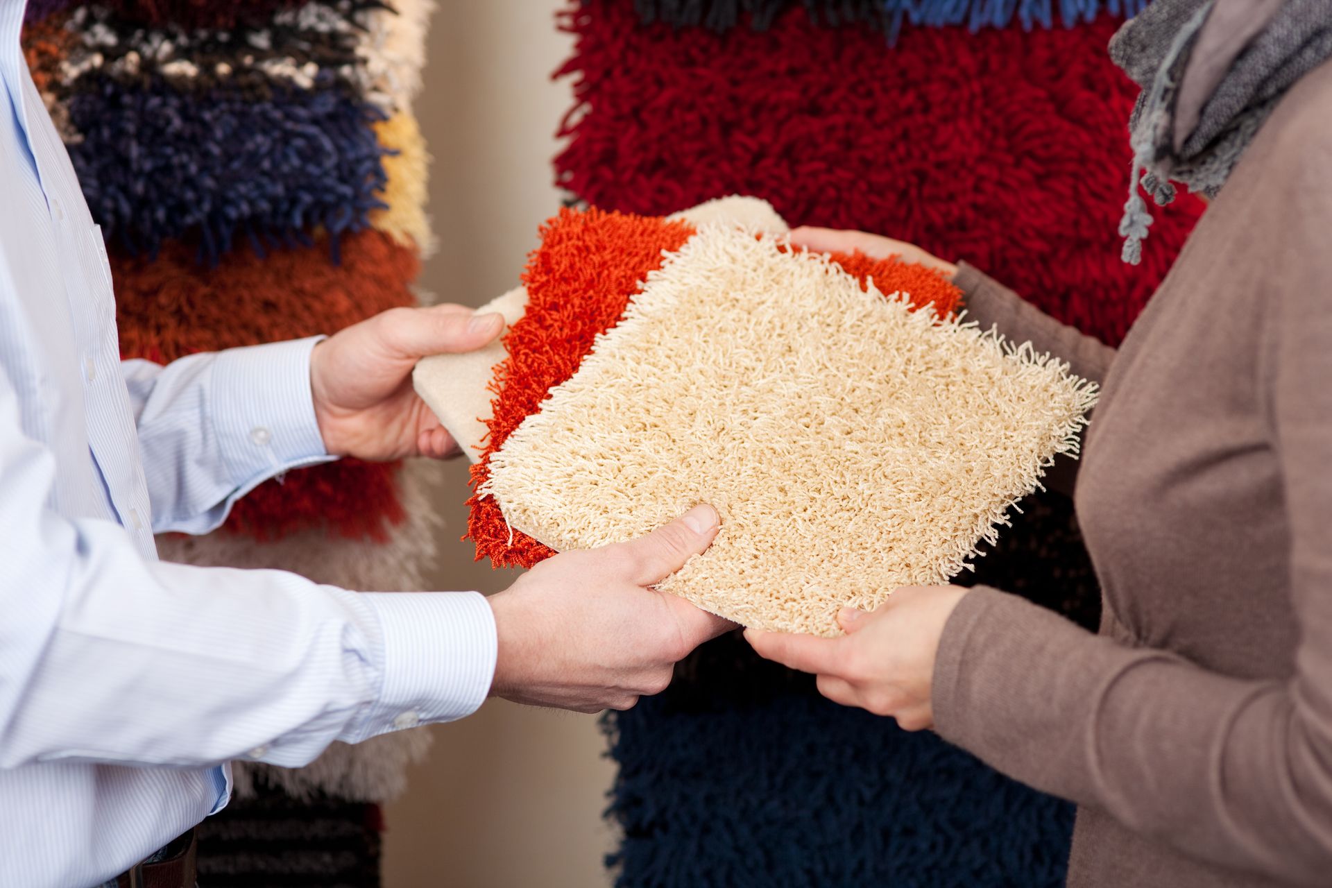 Woman looks at carpet samples