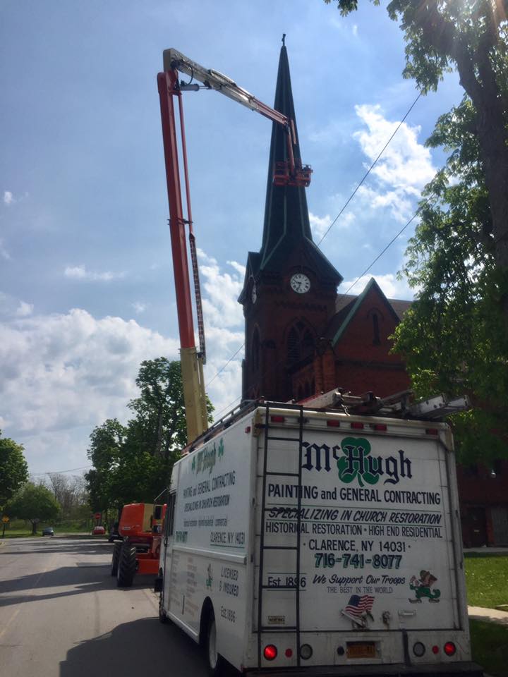 McHugh truck parked outside church steeple
