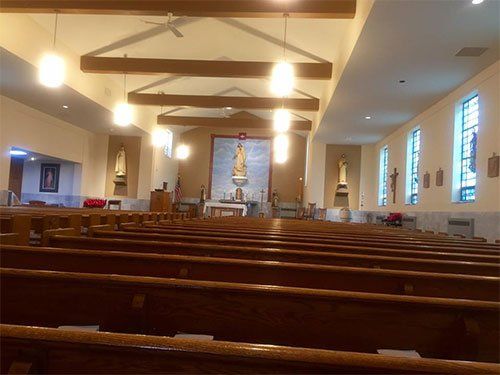 view of a church from the back pews