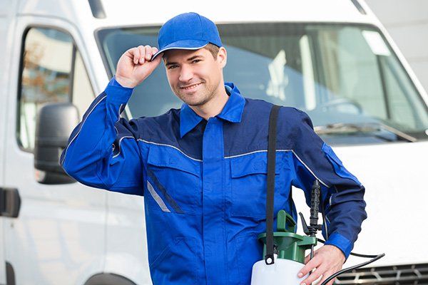 exterminator in front of service van