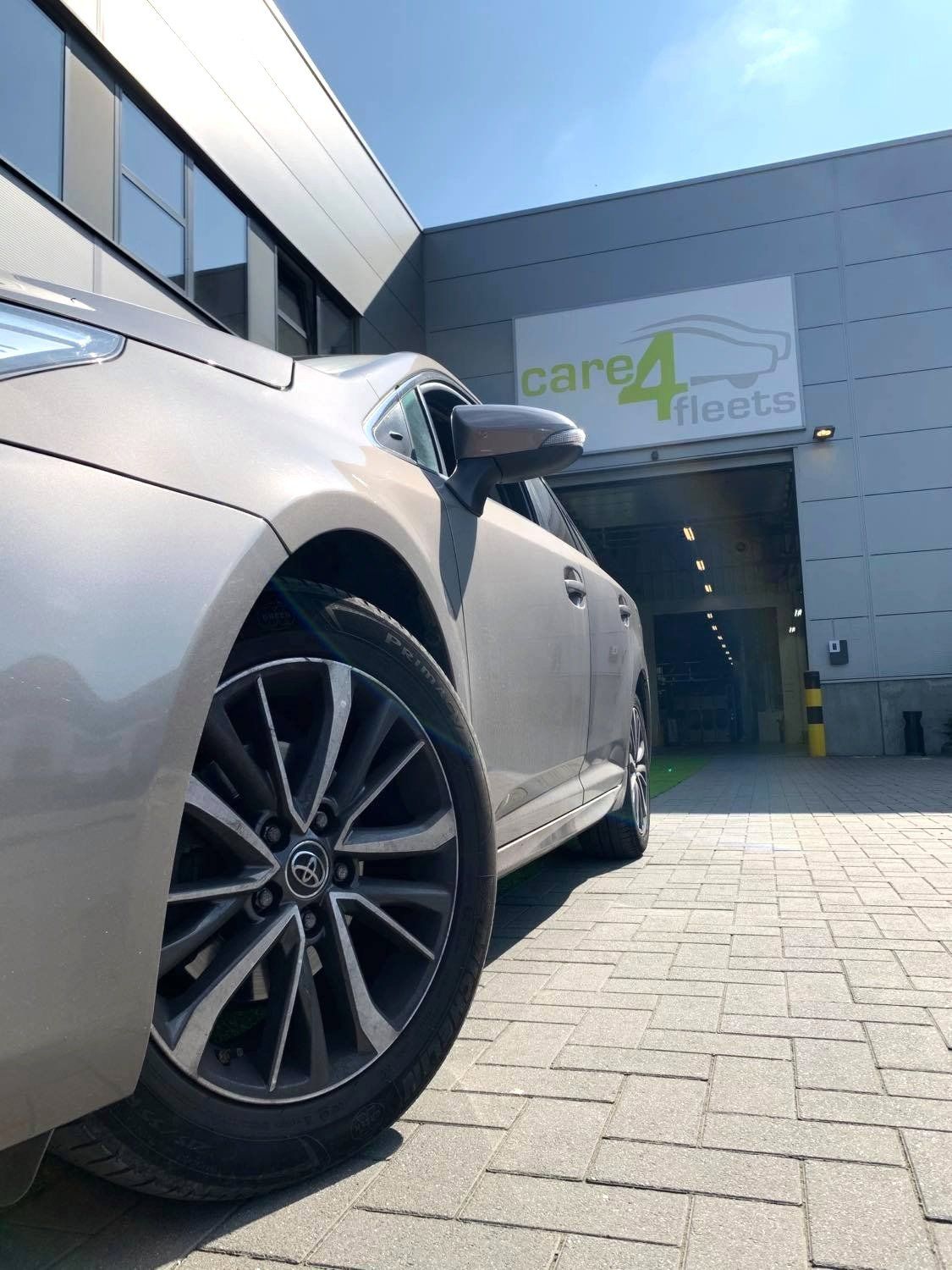 Photo of car being deliverd to customer at the care for fleets offices.