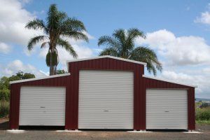 Red barn with white garage doors