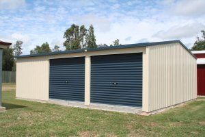 White outdoor garage with blue doors