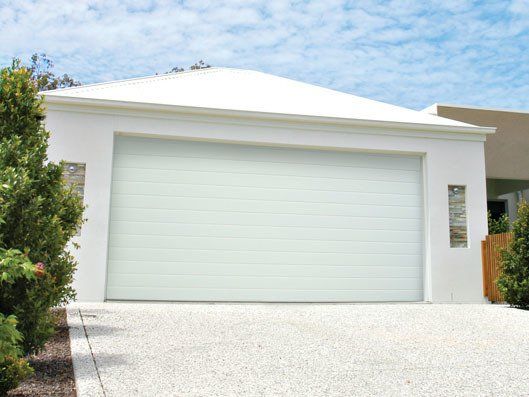 White colored house with garage door