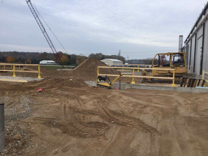 Black Truck and Excavator — Eden, WI — Baumhardt Sand & Gravel, Inc.