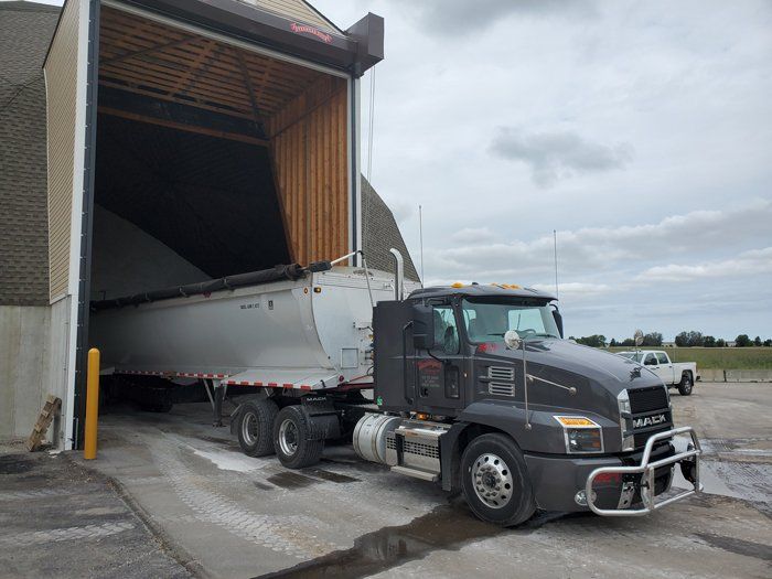 Excavator Trucks Outside the Building — Eden, WI — Baumhardt Sand & Gravel, Inc.