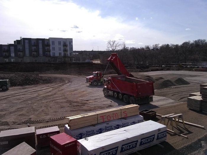Red Trucks on Construction Site — Eden, WI — Baumhardt Sand & Gravel, Inc.