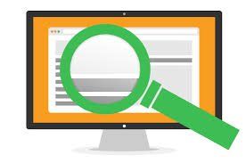 A computer monitor with a magnifying glass on it.