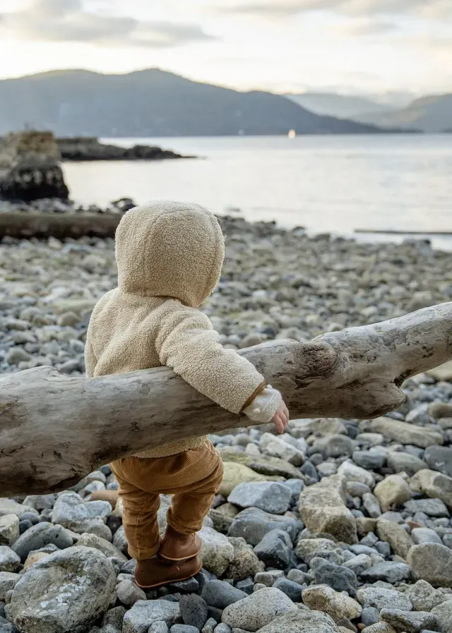baby by beach photo