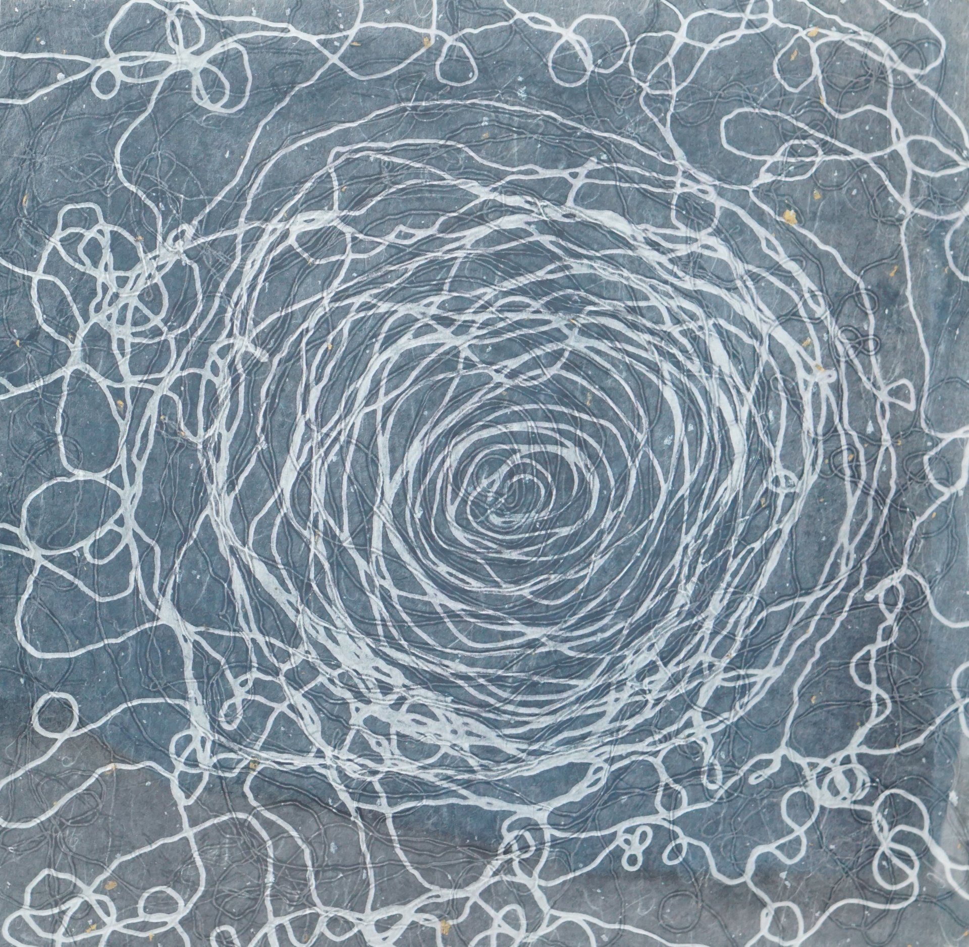 White scribbled lines form a swirling pattern on a gray background.