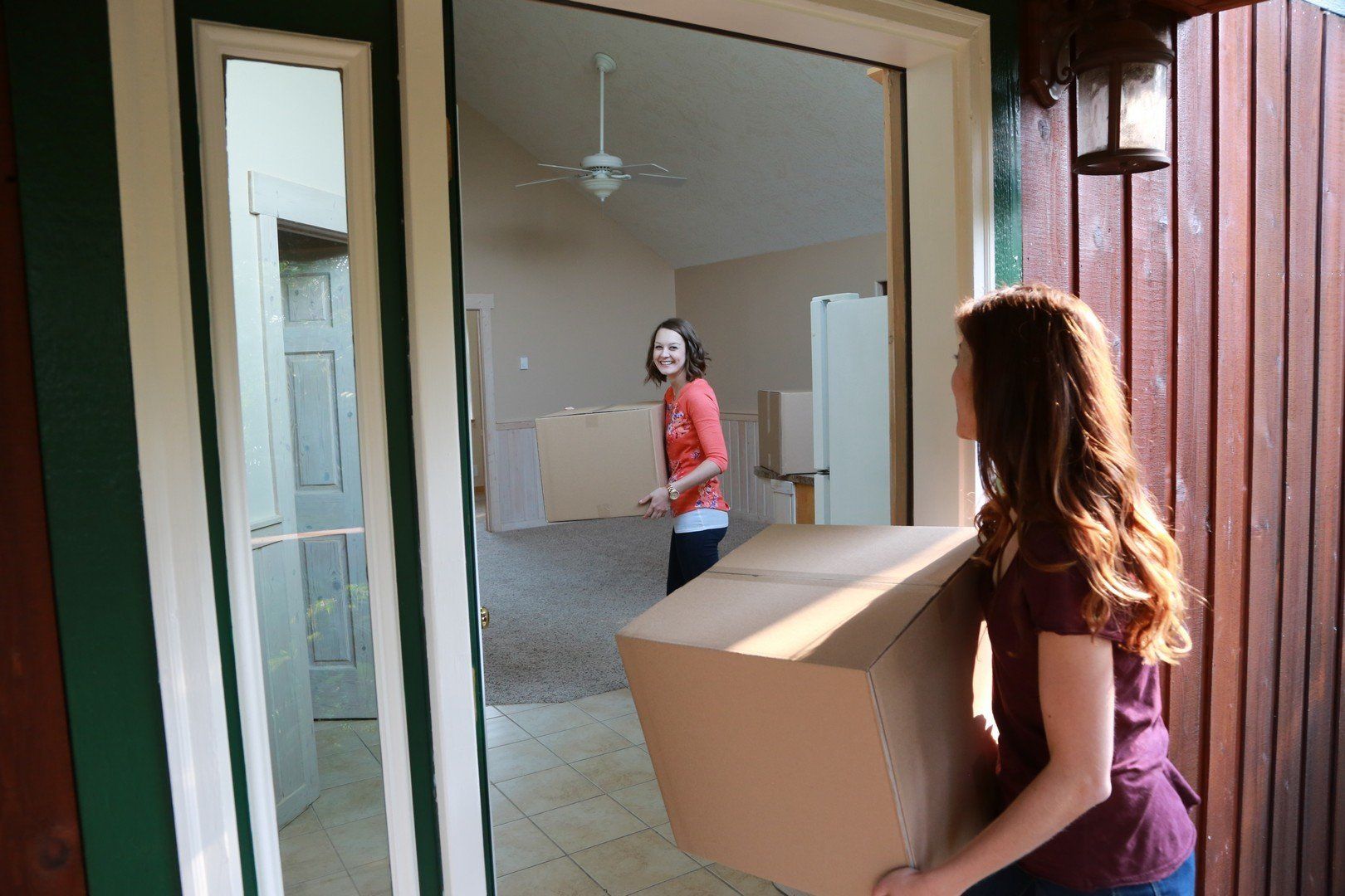Girls Moving Boxes