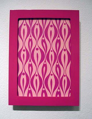 A pink picture frame with a pink pattern on it