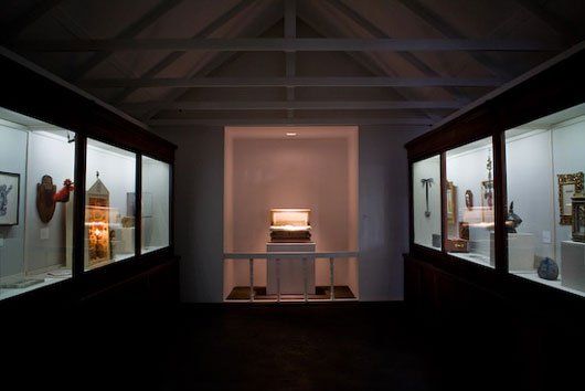 A museum with a lot of glass display cases