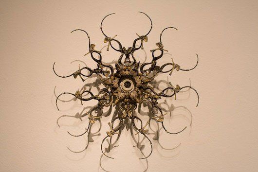 A close up of a circular sculpture on a wall