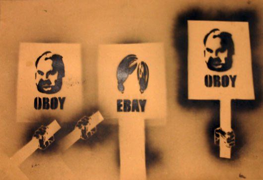 Three signs that say ebay and obey on them