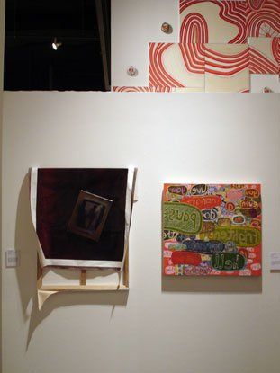 Two paintings are hanging on a wall next to each other.