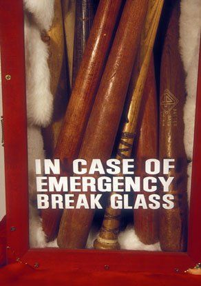 A sign that says in case of emergency break glass