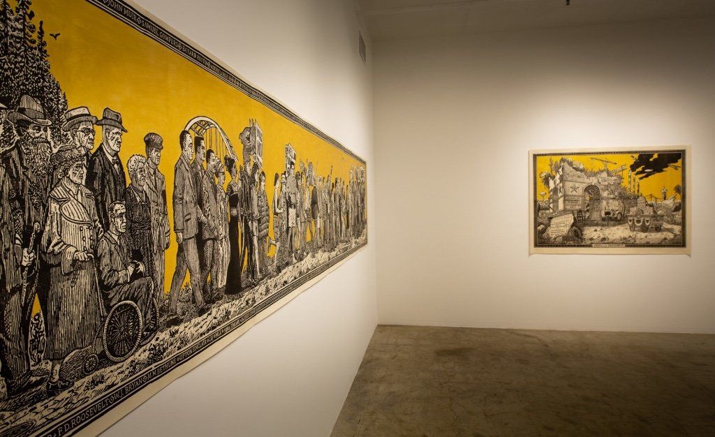 A room with a painting on the wall and a painting on the floor.