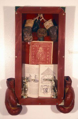 A red box with books and writings inside of it.