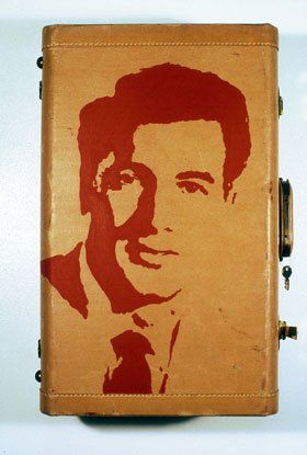 A suitcase with a picture of a man on it