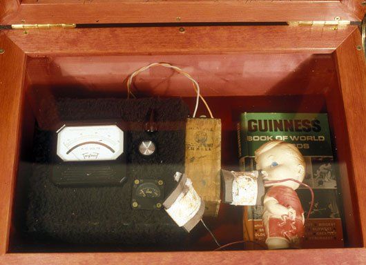 A guinness book sits in a wooden box