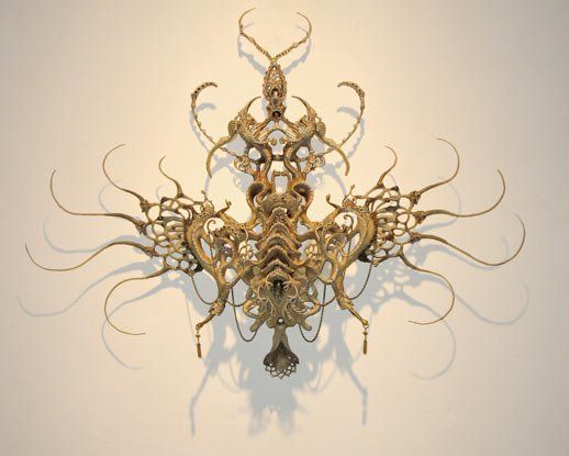A sculpture on a wall that looks like a skeleton