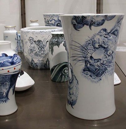 A row of blue and white vases on a table