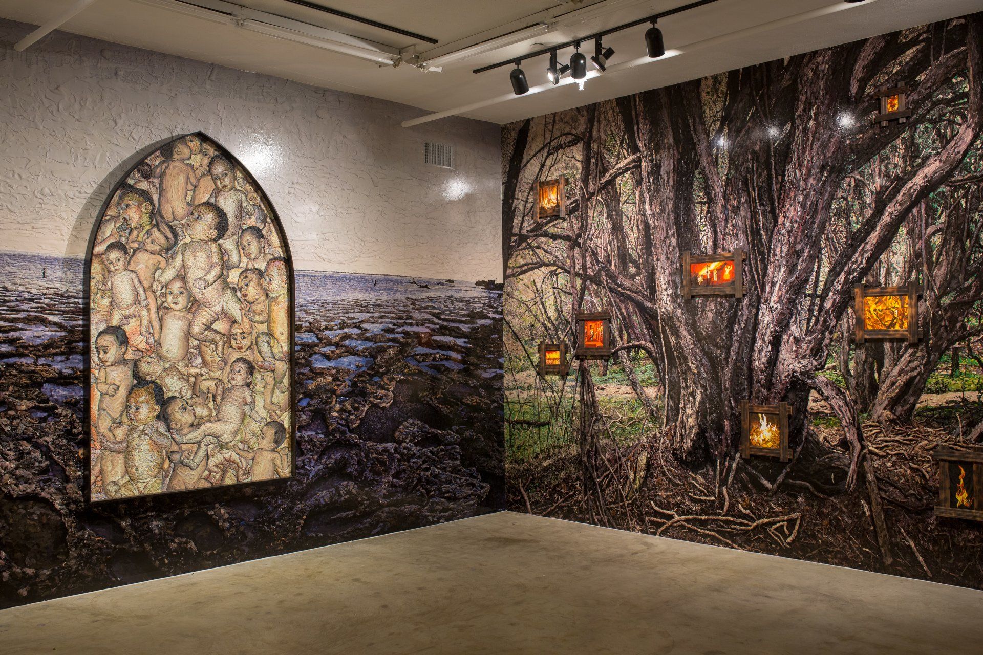 A room with a painting of a tree on the wall.