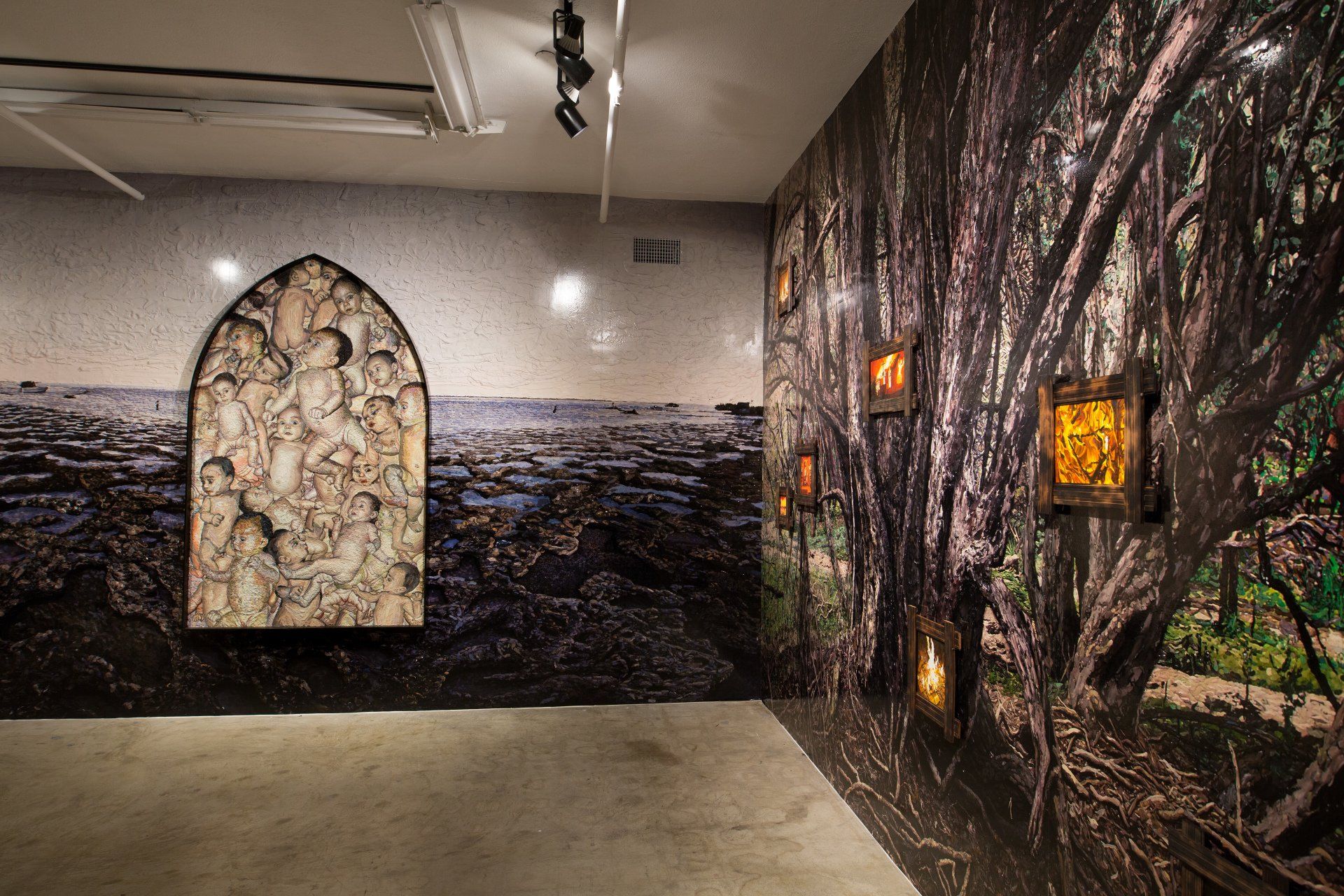 A room with a painting of trees on the wall