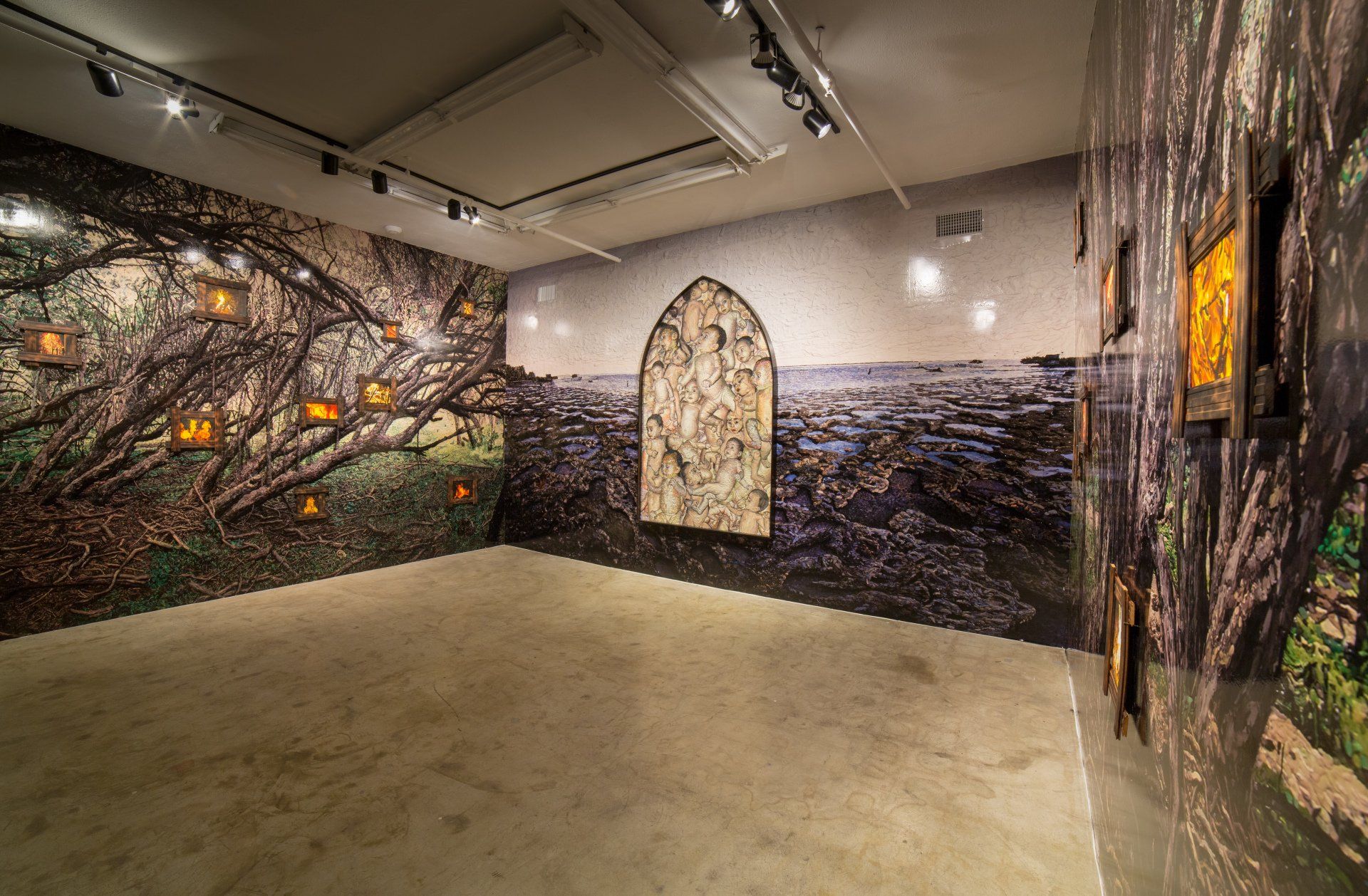 An empty room with a large painting on the wall.