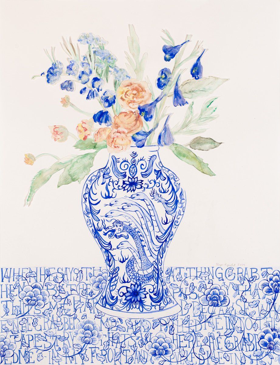 A blue and white vase filled with flowers on a table.