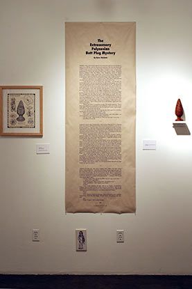 A large piece of paper is hanging on a white wall