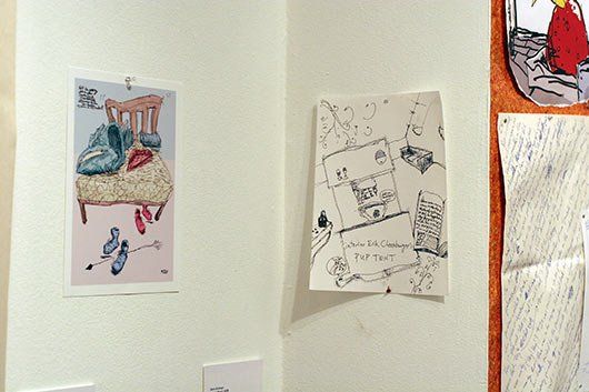 A white wall with a drawing of a chair on it