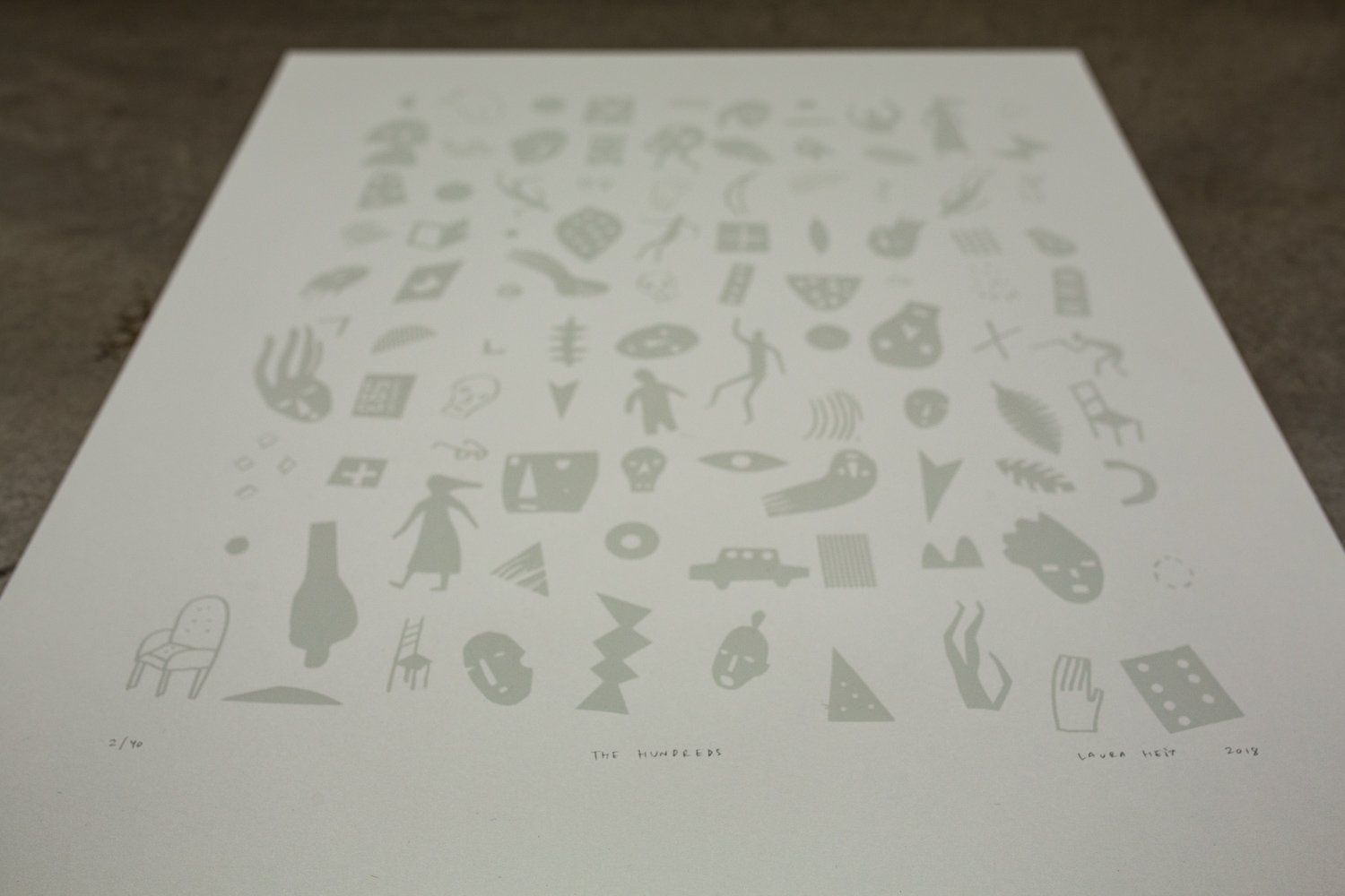 A white sheet of paper with a lot of drawings on it.