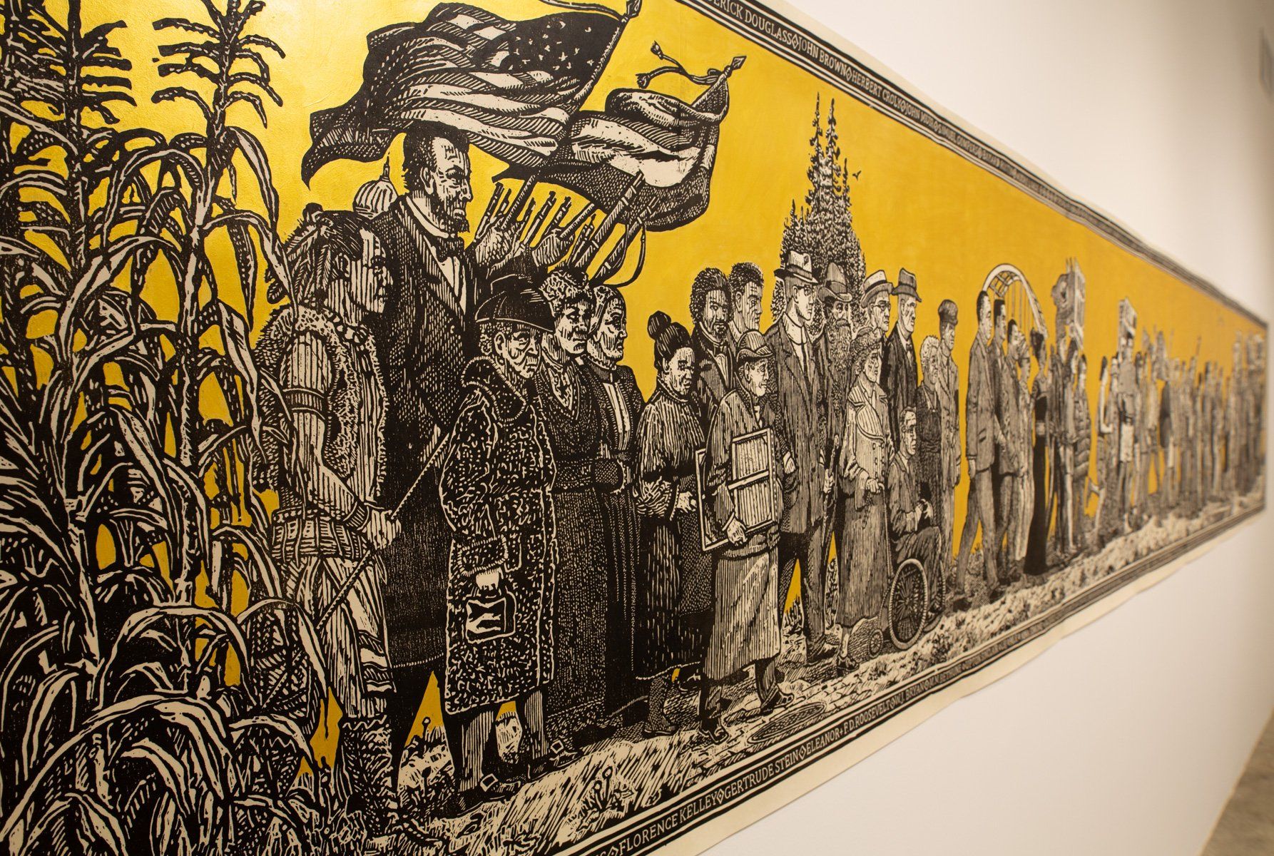 A black and white painting of a group of people standing next to each other on a wall.