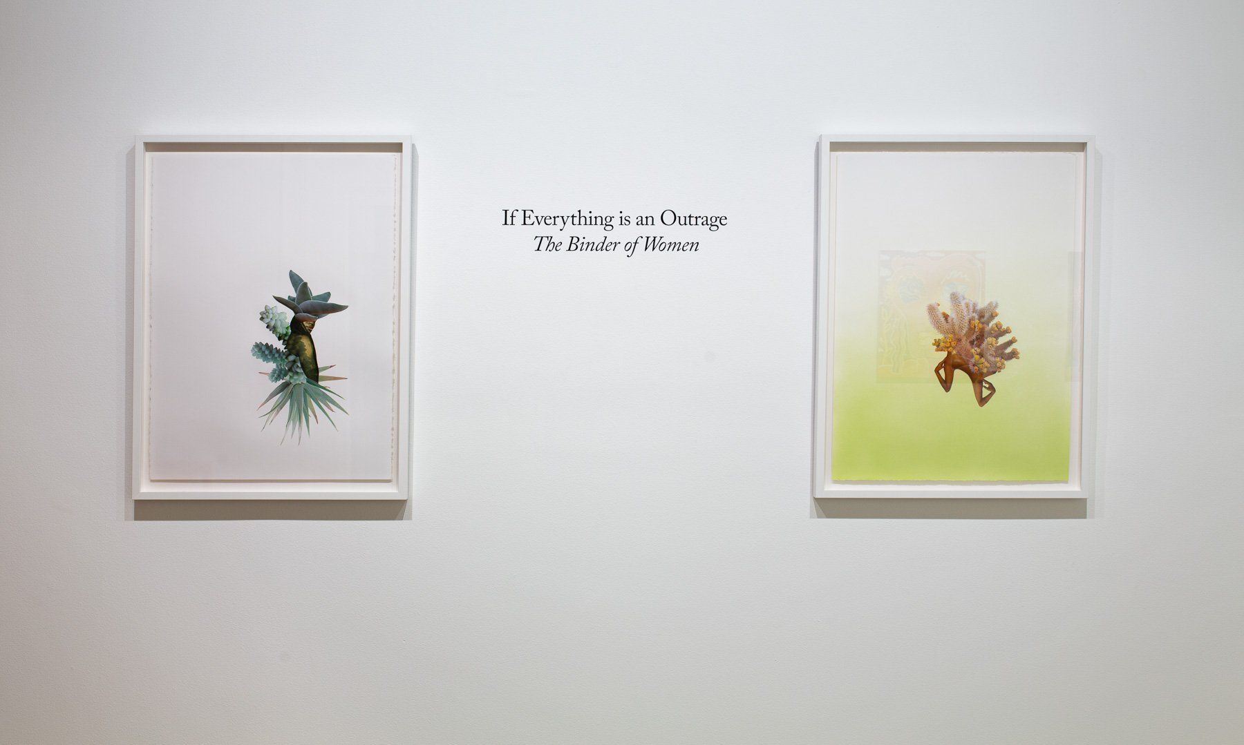 Two framed paintings are hanging on a white wall.