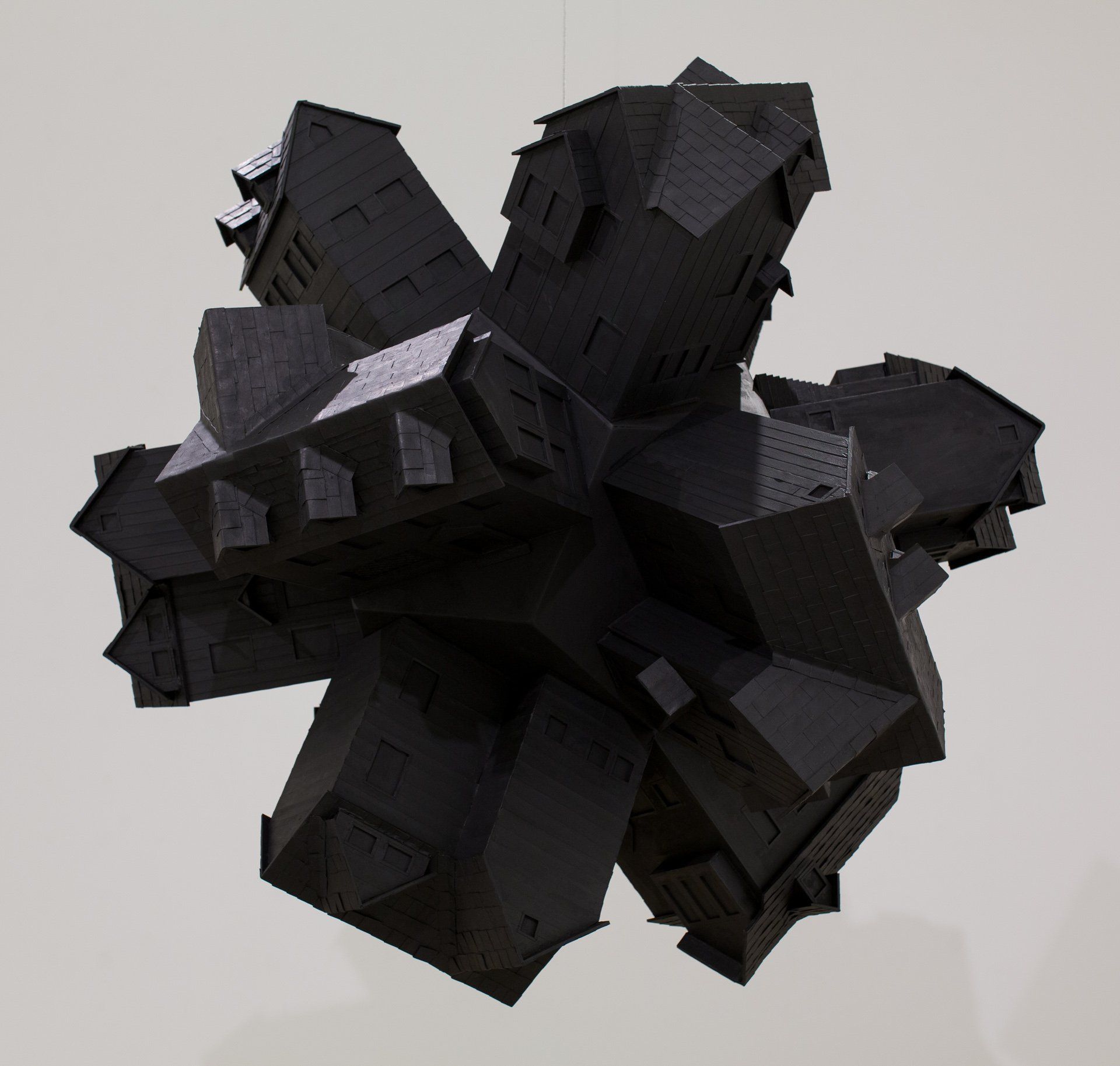 A group of black houses are stacked on top of each other
